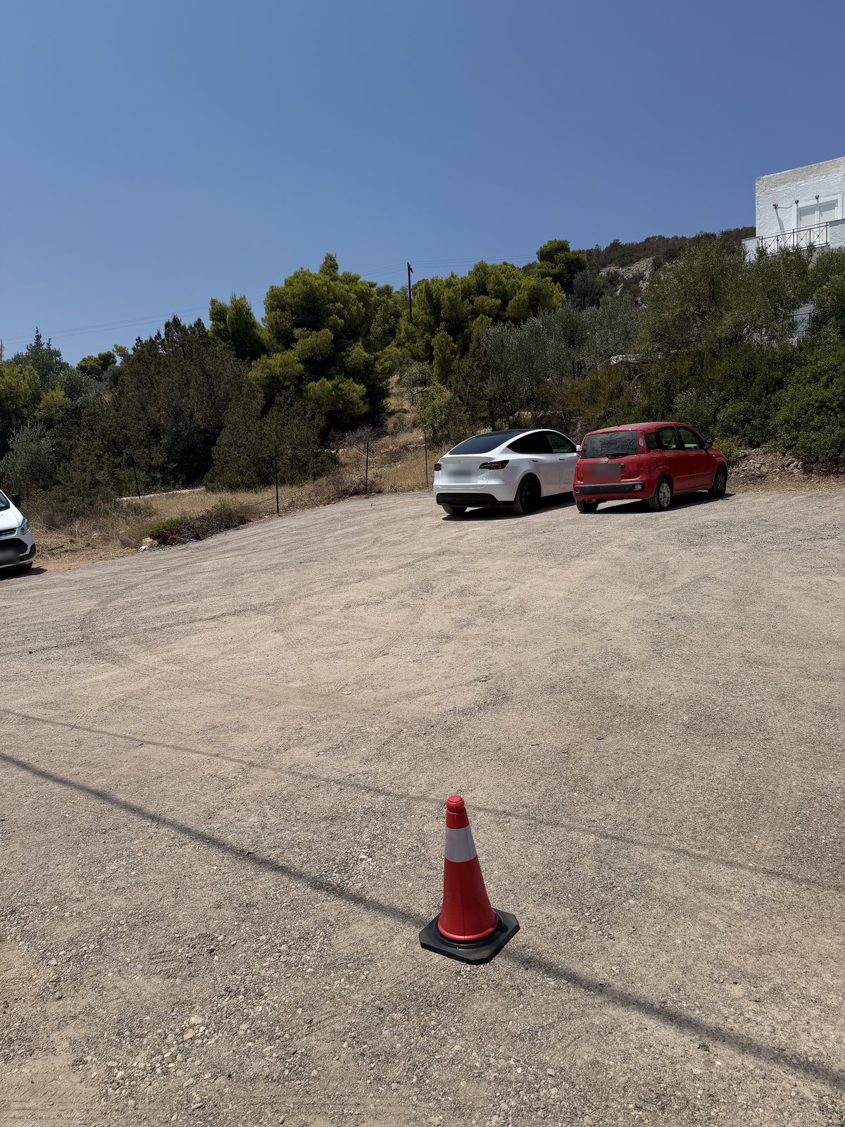 The P2 parking area: a larger gravel lot on the hillside off Konstantinou Kanari, a minute from the hotel.