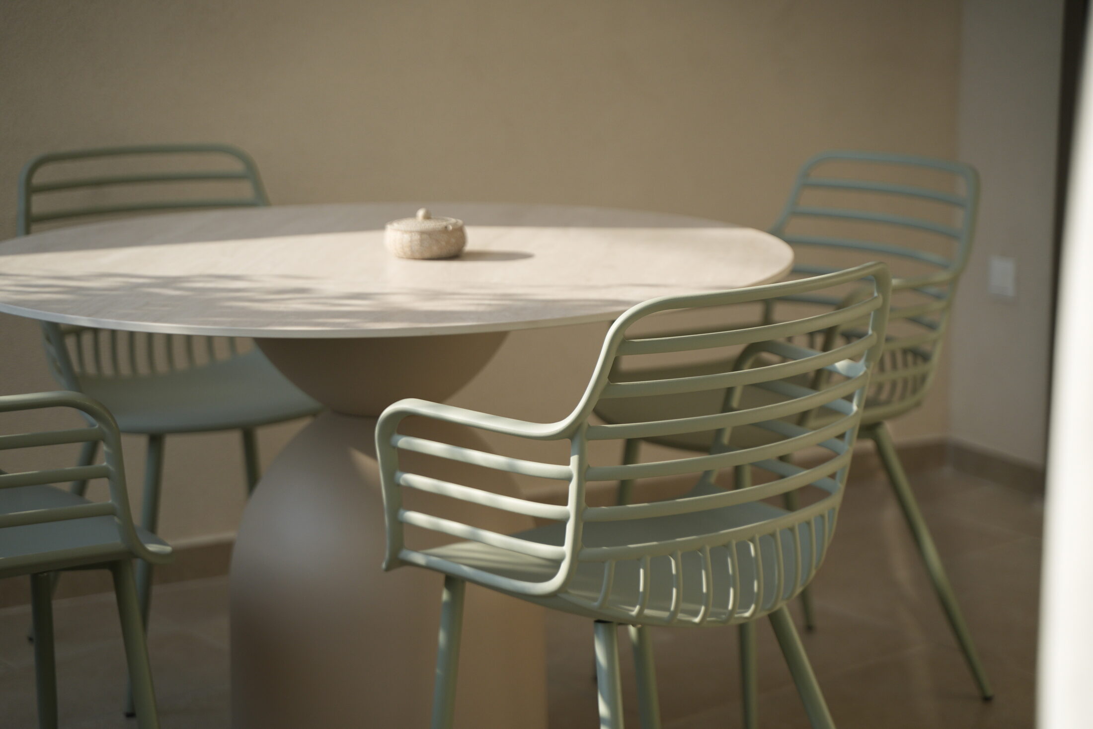 The kitchenette — induction, sink, a shelf of cups