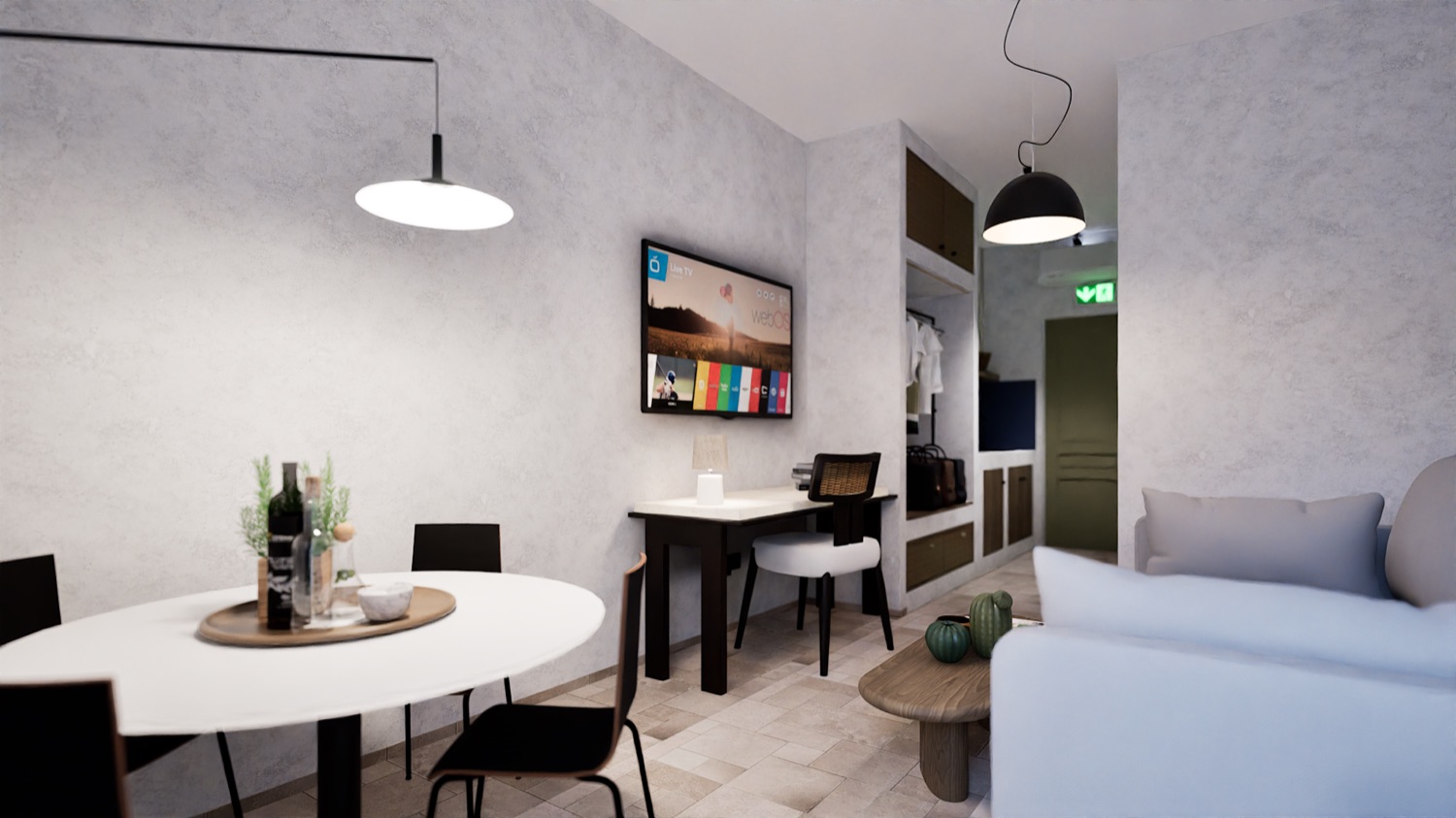 The kitchenette — induction, sink, a shelf of cups